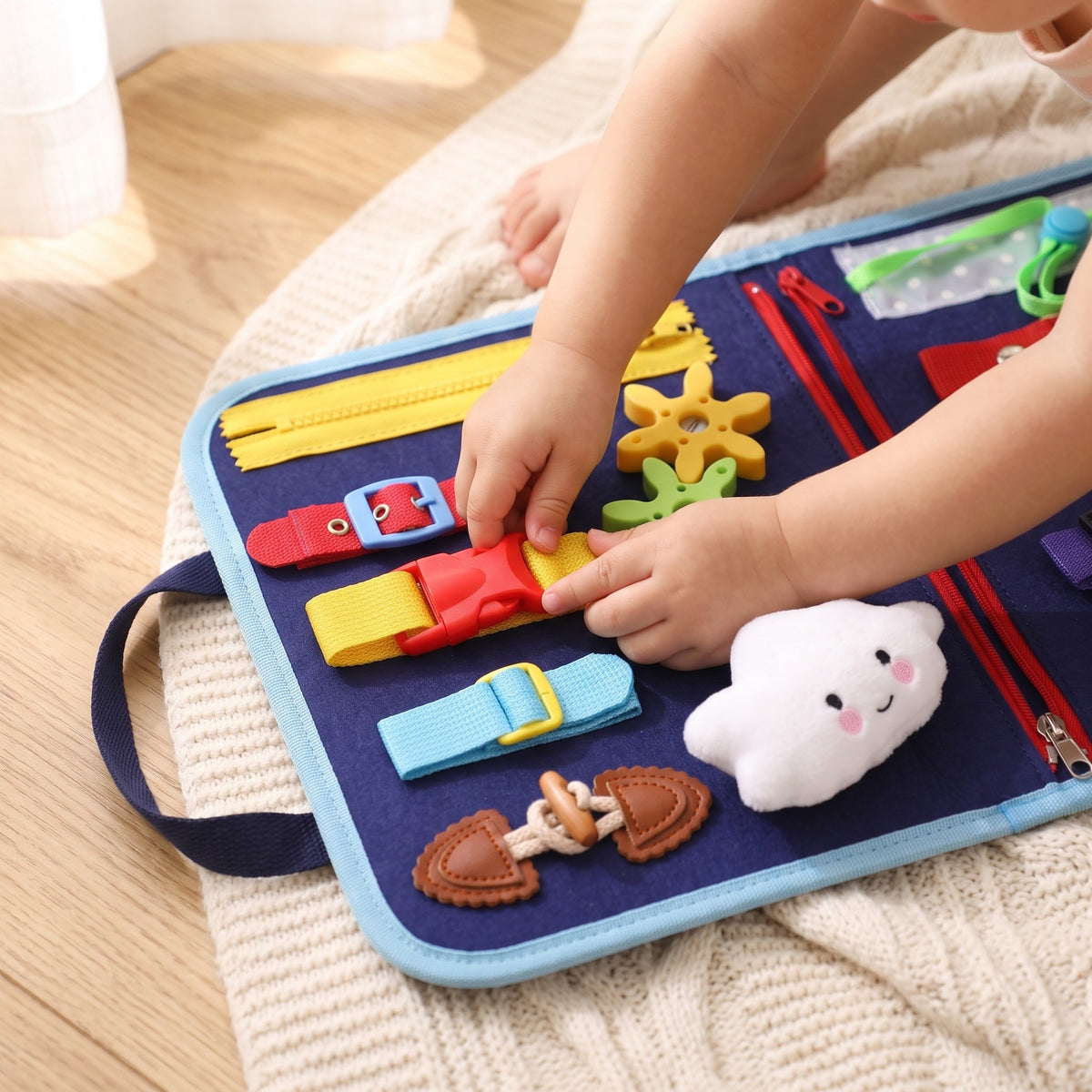Montessori Activity Board: a child's hands buckle