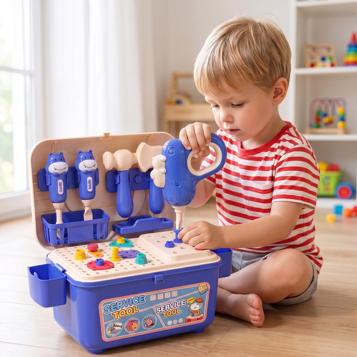 A child playing with the BuildBox tool bench