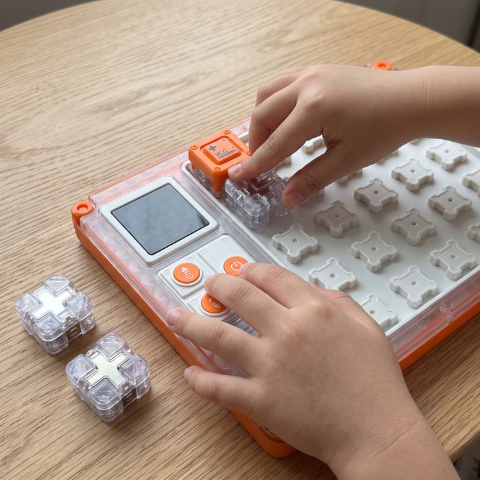 STEM Circuit Puzzle Board: a child's hands snapping cube