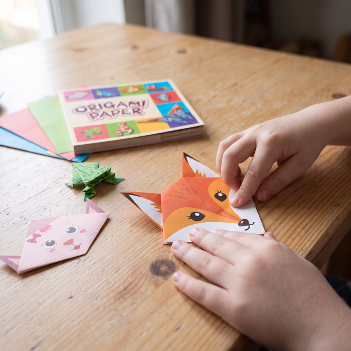 Foldspark Origami Studio: a child's hands