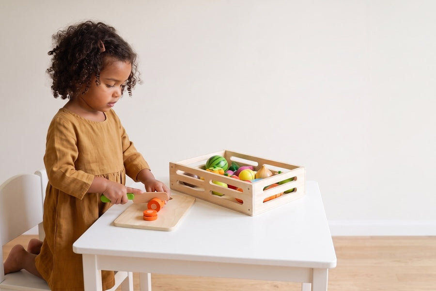 A child playing with the Fruit and Veggie Cutting Set