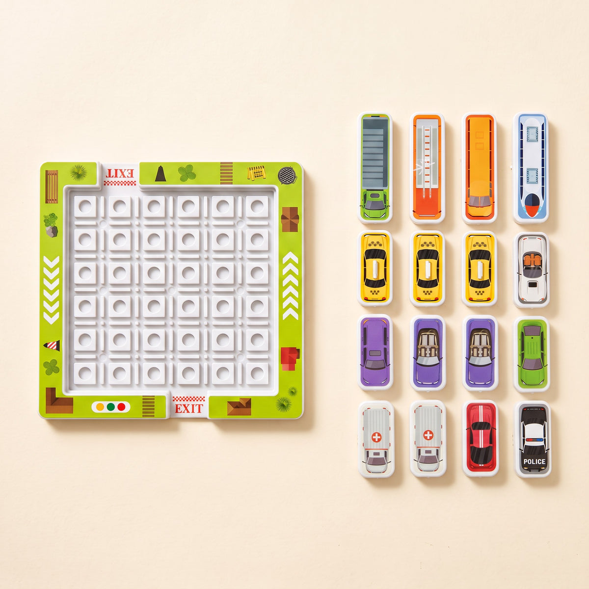 The empty board laid out next to 16 vehicle tiles, such as 3 taxis, 2 ambulances, a bus, a fire truck and a police car