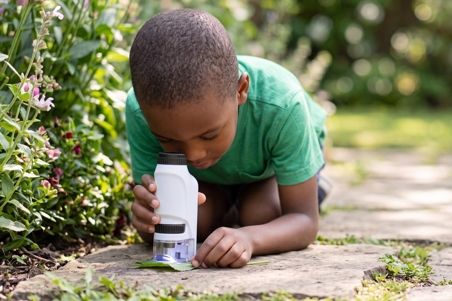 A child playing with the Groovd Miniscope